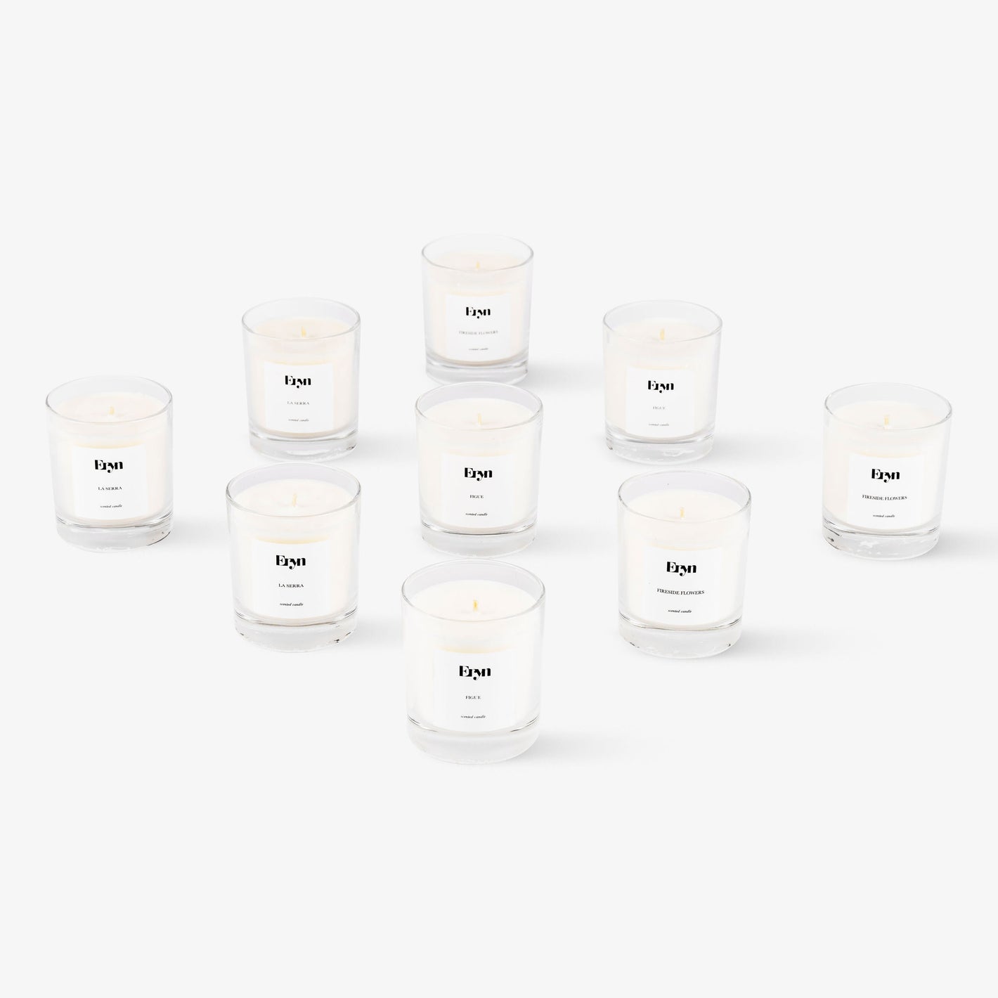 Image of multiple clean burning scented candles from Eryn on light grey background
