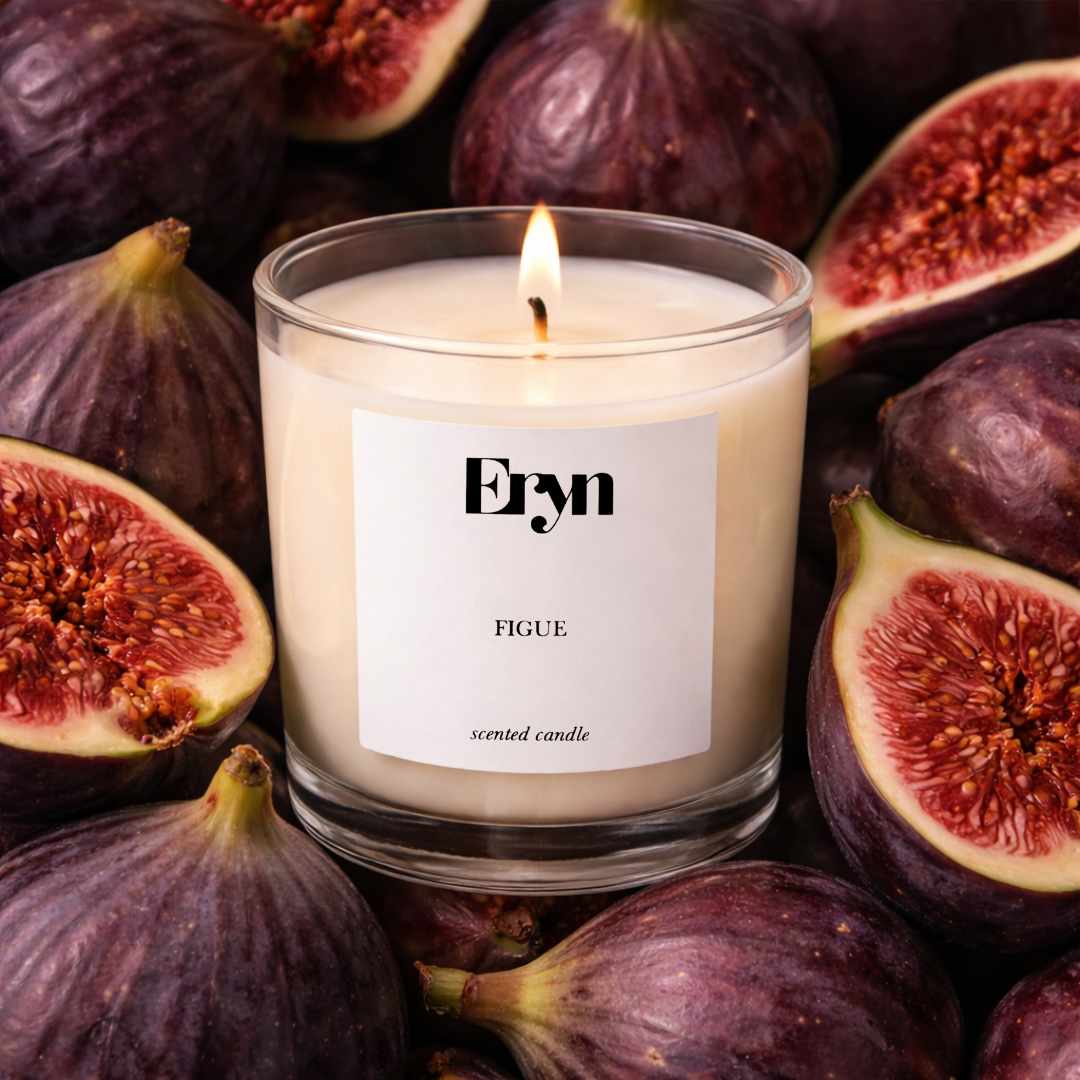 Eryn Figue clean-burning candle styled on  a bed of fresh figs