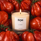 Eryn La Serra clean-burning candle in glass vessel surrounded by vine tomatoes